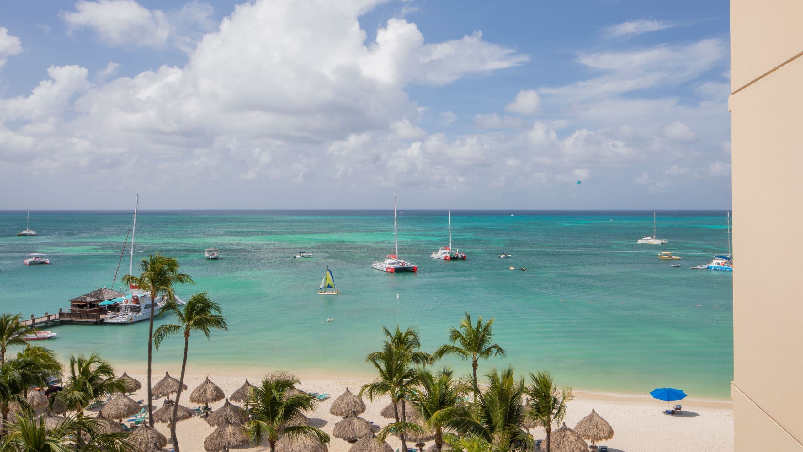 Palm Beach view with palapas from Hyatt Regency Aruba