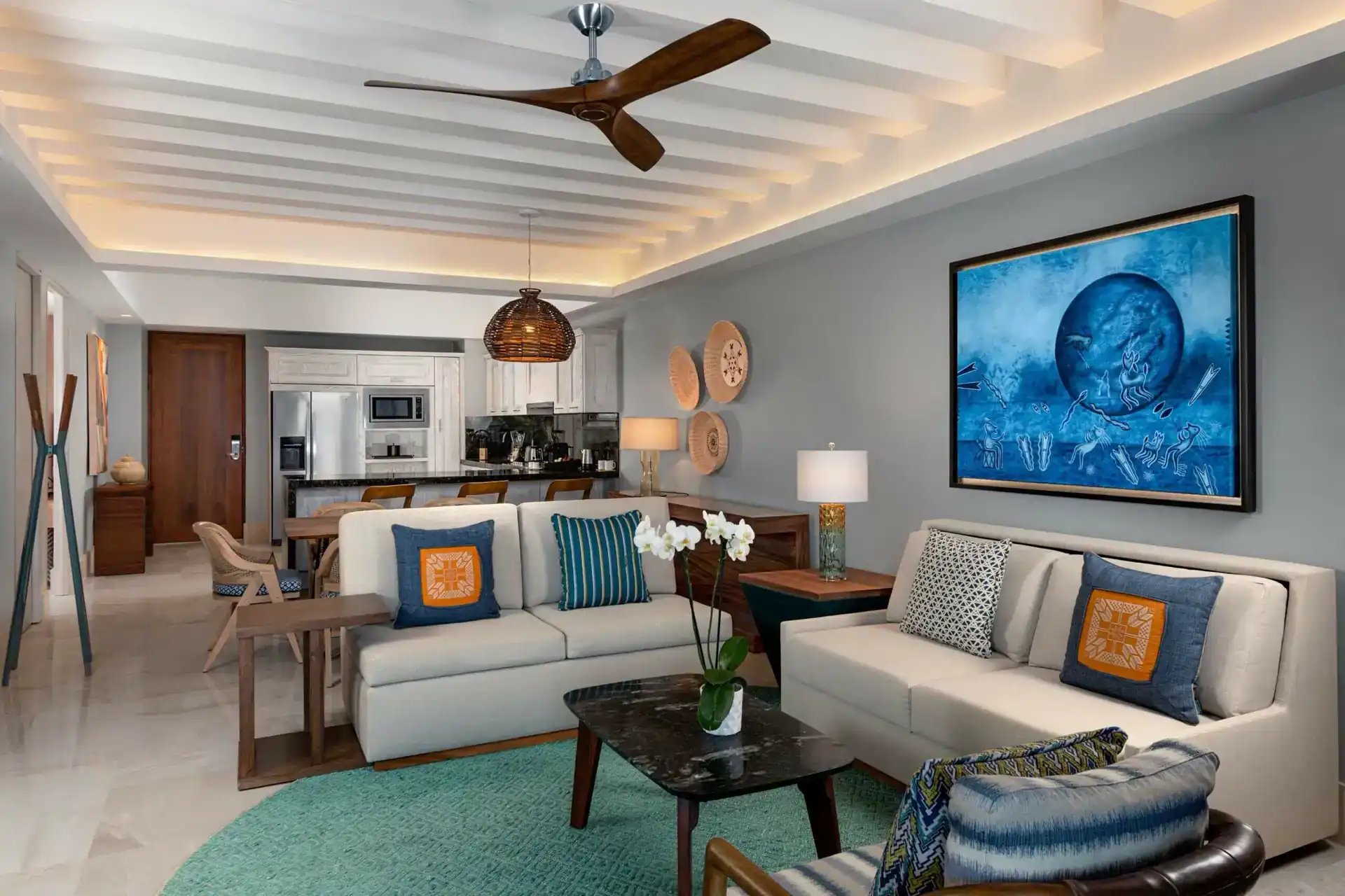 Two-bedroom suite living room and kitchen at Conrad Punta de Mita