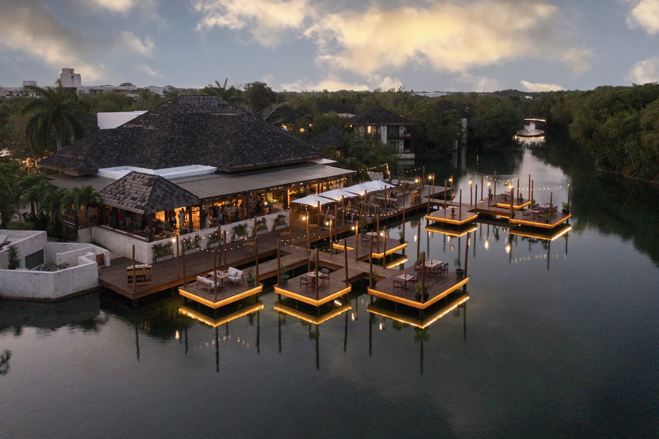 La Laguna overwater dining exterior at dusk at Fairmont Mayakoba