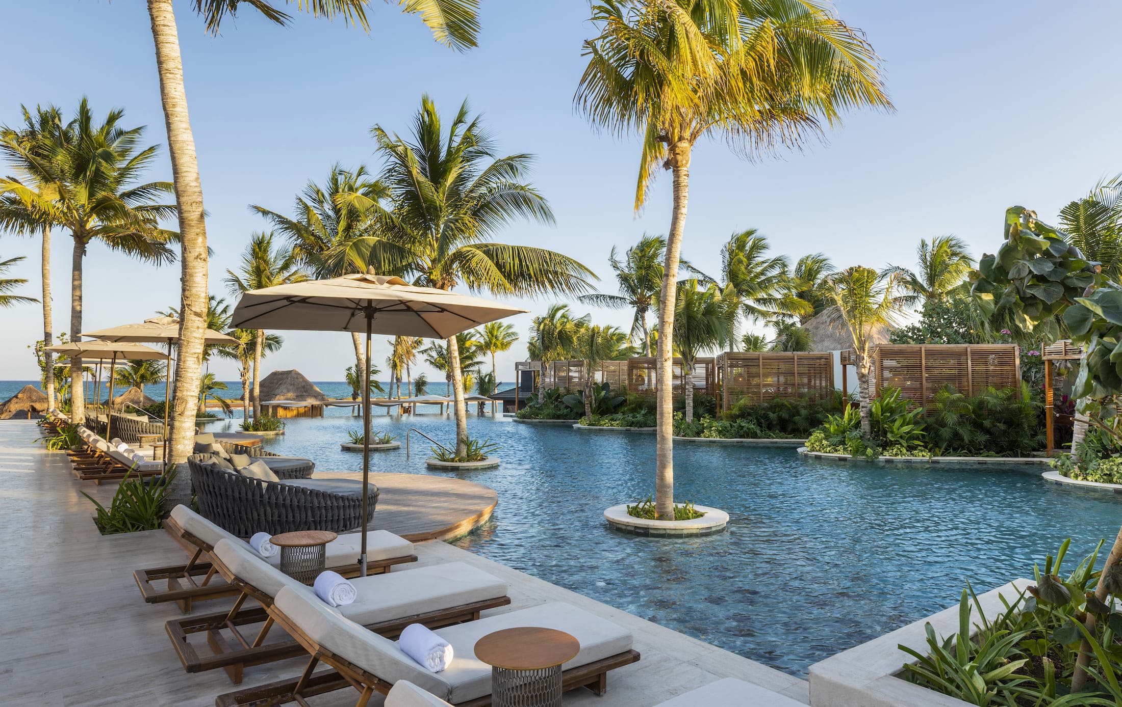 Resort pool with loungers at Fairmont Mayakoba
