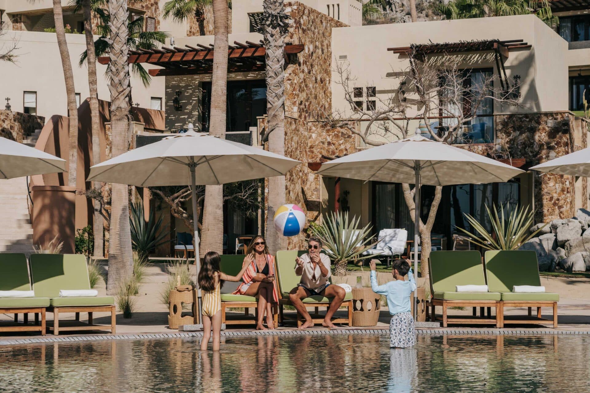 Families playing in the outdoor pool