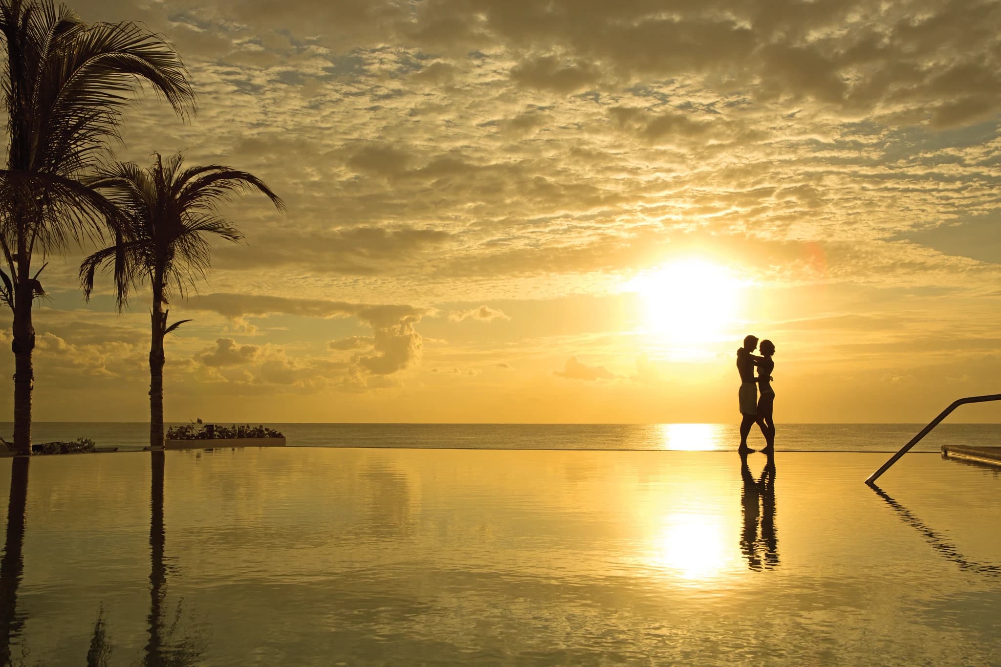 Infinity pool at sunrise at Secrets The Vine Cancun